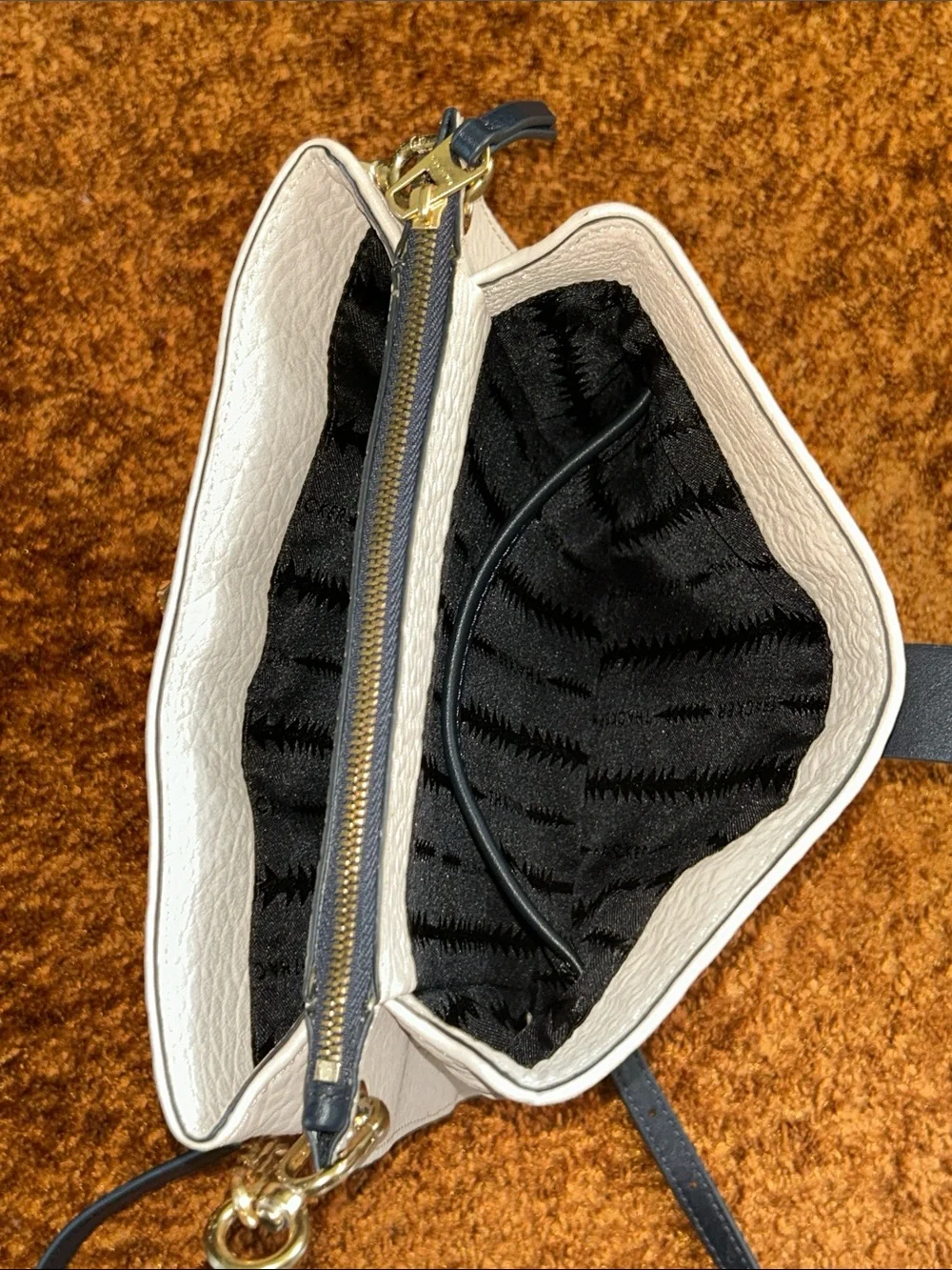 Cream Crossbody Bag with Black Strap and Gold Chain Accent